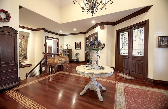 foyer featuring a towering ceiling and hardwood / wood-style flooring