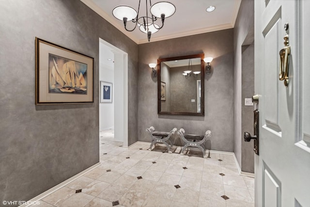 bathroom featuring an inviting chandelier, crown molding, and baseboards