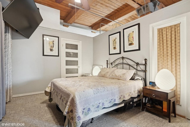 carpeted bedroom with beam ceiling, ceiling fan, and wooden ceiling