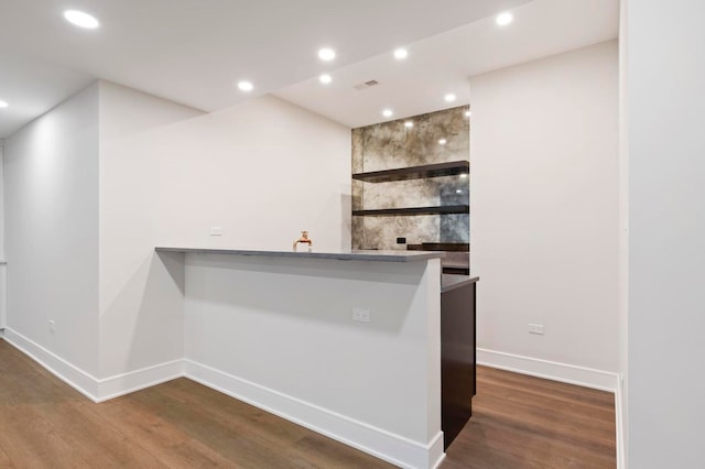 bar featuring hardwood / wood-style flooring