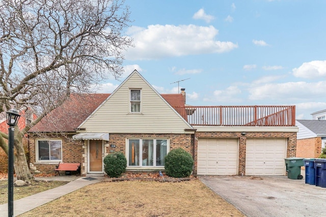 view of front of home with a garage and a front yard