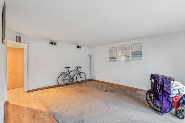 miscellaneous room featuring hardwood / wood-style flooring