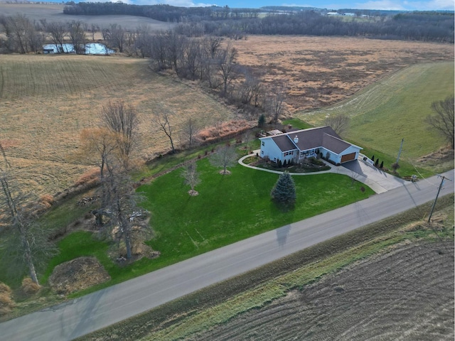 birds eye view of property with a rural view