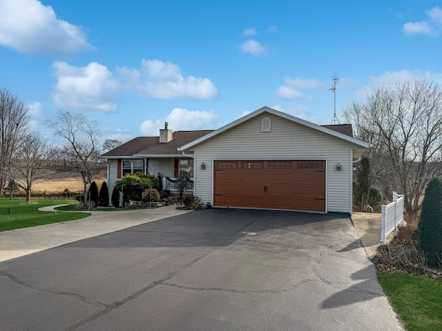 ranch-style house featuring a garage