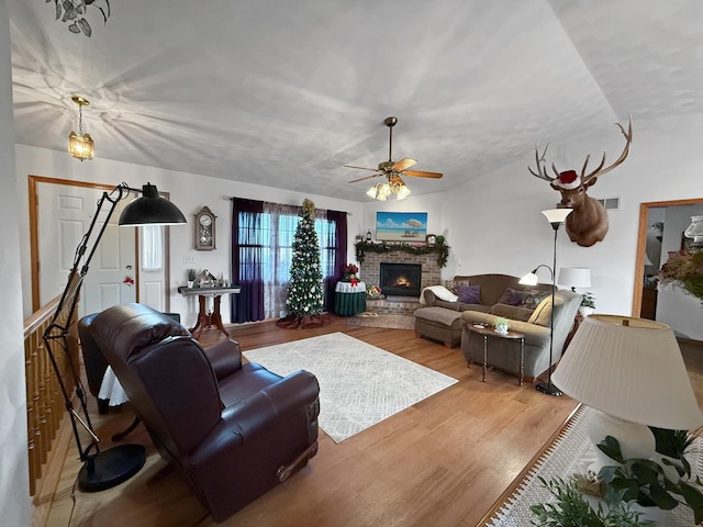 living room with light hardwood / wood-style floors and ceiling fan