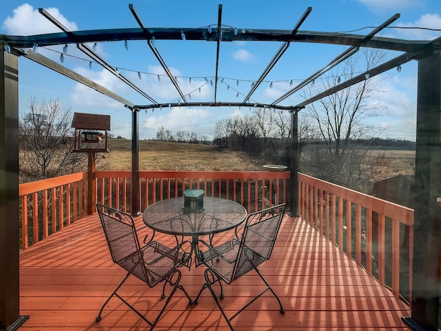 wooden terrace featuring a rural view