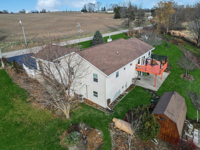 birds eye view of property with a rural view