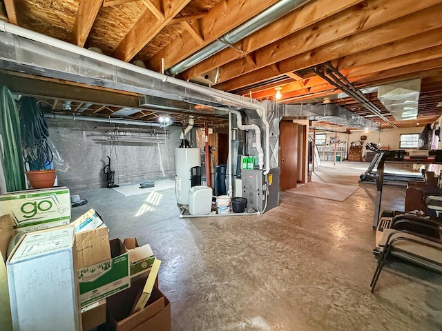 basement with gas water heater and heating unit