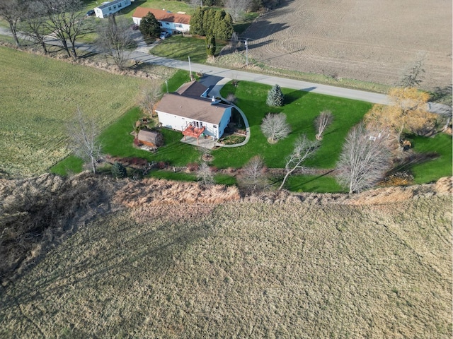 birds eye view of property with a rural view