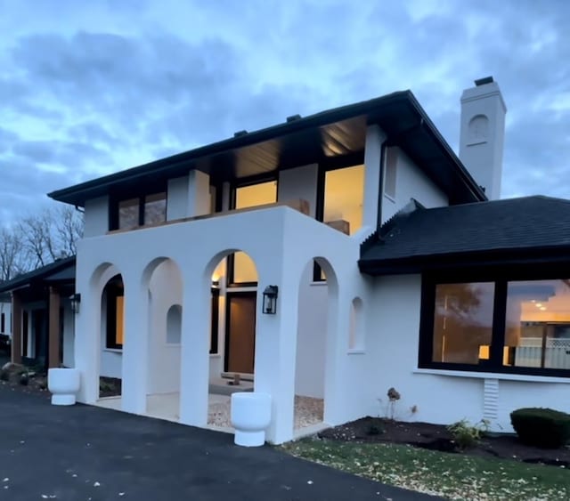 view of front of house with a balcony