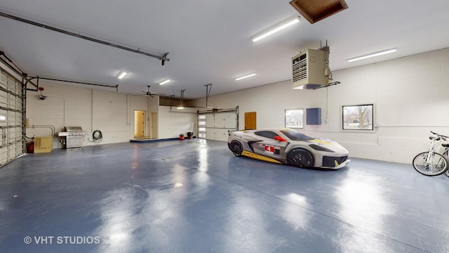 garage featuring electric panel and a garage door opener