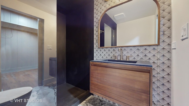 bathroom with vanity and backsplash