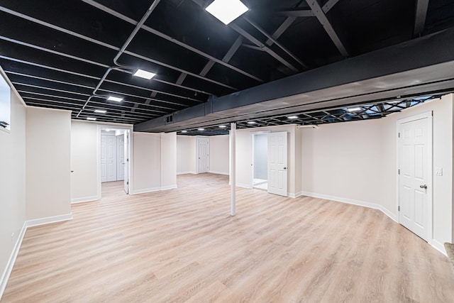 basement with wood-type flooring