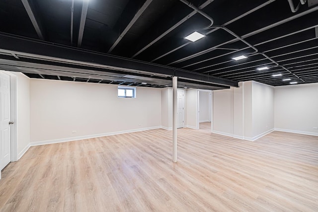 basement featuring light hardwood / wood-style flooring