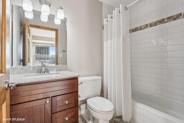 full bathroom with vanity, toilet, and shower / bath combo