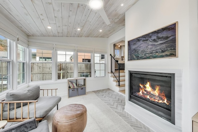 living room featuring lofted ceiling and wood ceiling