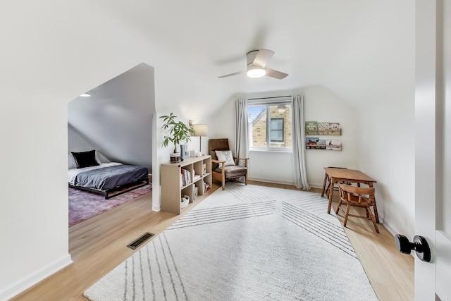 interior space featuring ceiling fan, light hardwood / wood-style flooring, and lofted ceiling