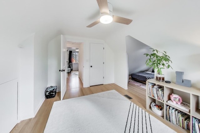 additional living space featuring light hardwood / wood-style floors, lofted ceiling, and ceiling fan