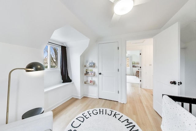 bedroom with lofted ceiling and wood-type flooring