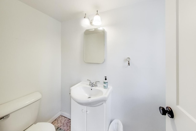 bathroom with toilet and vanity