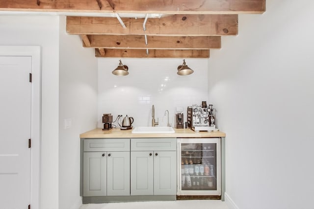 bar featuring sink, wine cooler, tasteful backsplash, and beamed ceiling