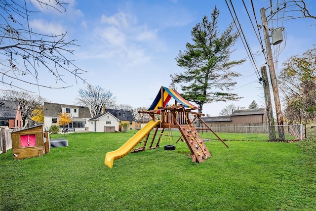 view of playground with a lawn