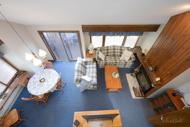 living room featuring carpet floors and a notable chandelier