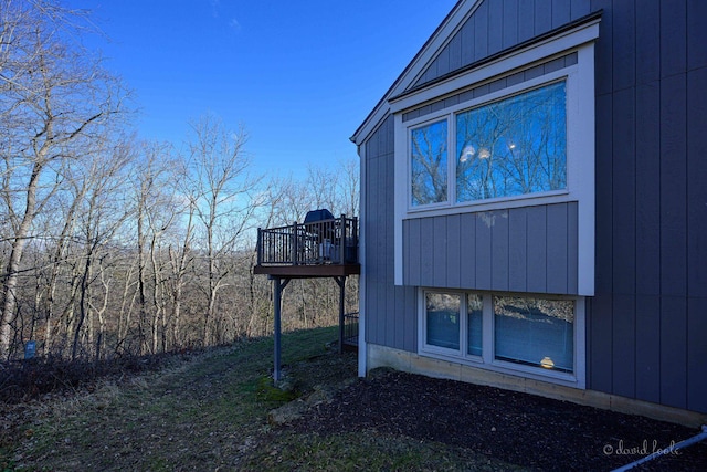 view of home's exterior featuring a wooden deck