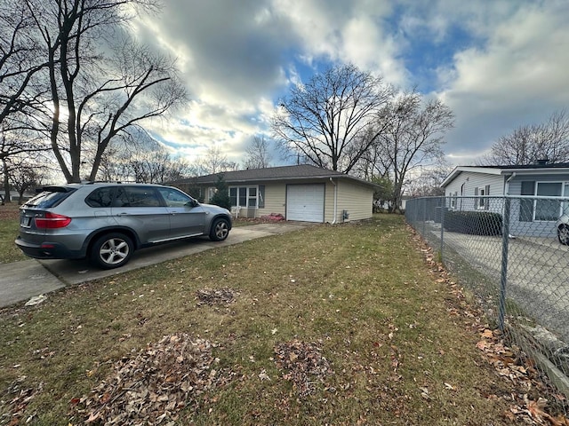 view of side of home with a garage and a yard