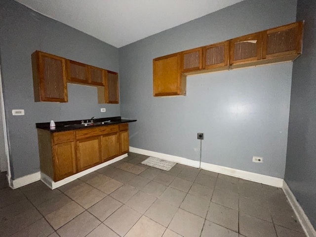 kitchen featuring tile patterned floors and sink