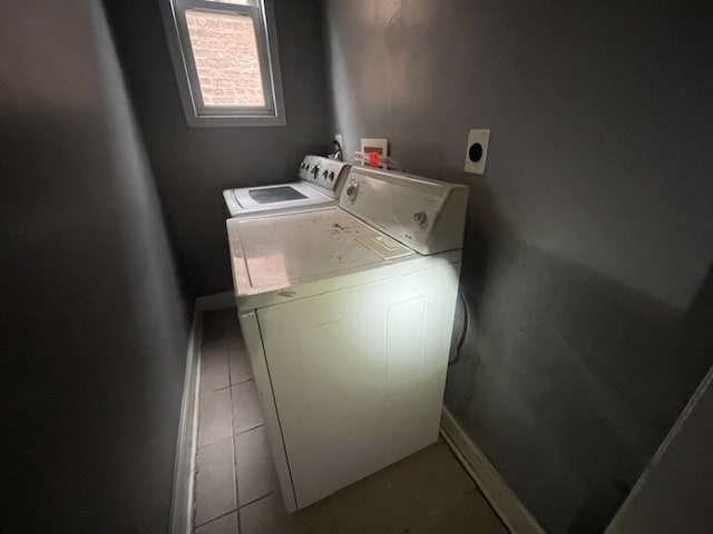 washroom featuring tile patterned floors and washing machine and dryer