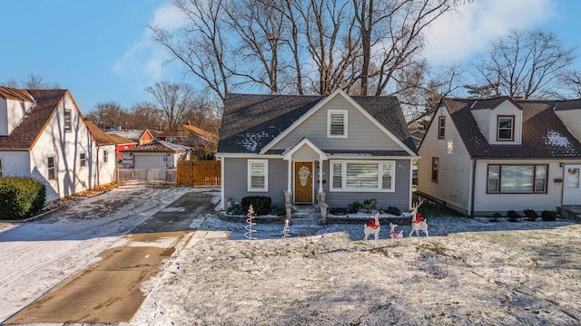 view of front of house featuring a garage and an outdoor structure