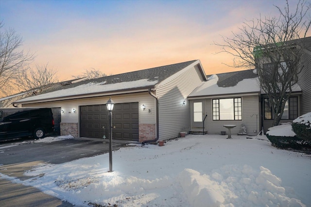 ranch-style home featuring a garage