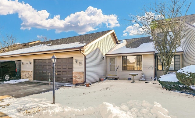 single story home featuring a garage