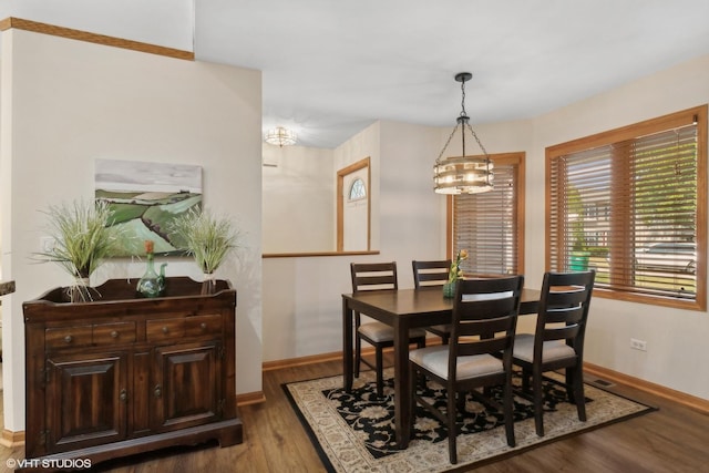 dining space with hardwood / wood-style floors