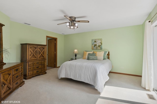 bedroom with light carpet and ceiling fan