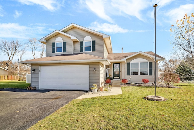 view of front of home featuring a garage and a front yard