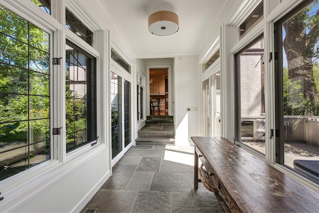 unfurnished sunroom with a wealth of natural light