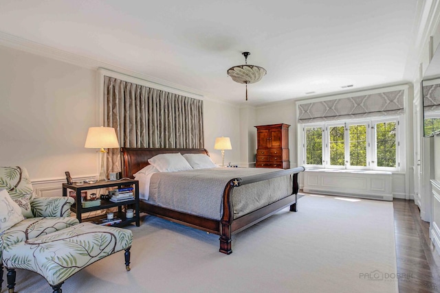 bedroom with crown molding