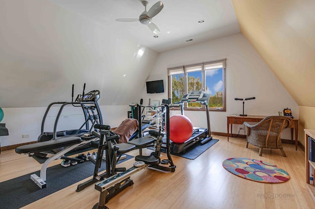 exercise area with ceiling fan, light wood-type flooring, and lofted ceiling