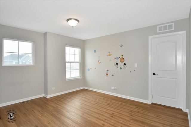 unfurnished room featuring light wood-type flooring