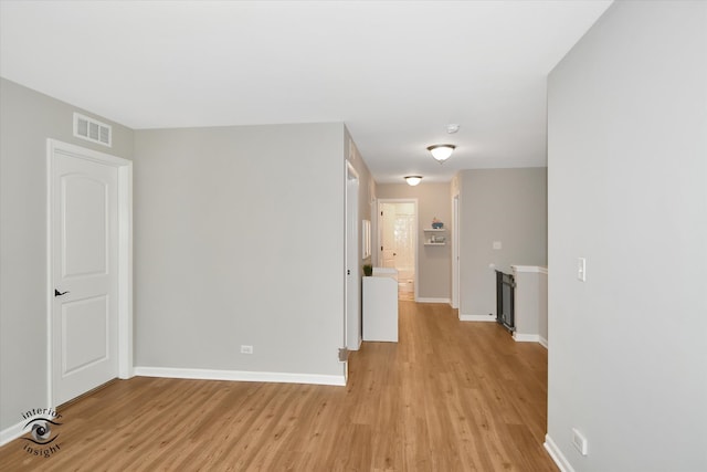 unfurnished room featuring light hardwood / wood-style flooring