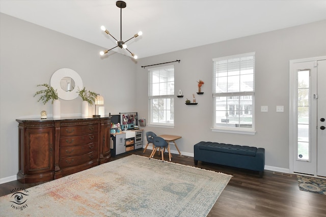 interior space with dark hardwood / wood-style flooring and an inviting chandelier