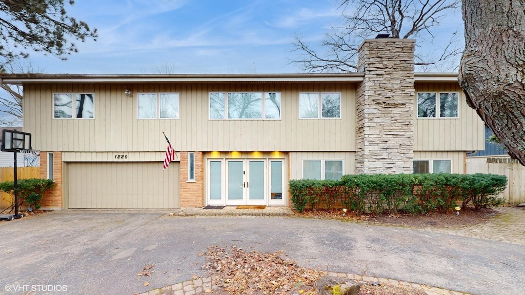 view of front facade featuring french doors and a garage