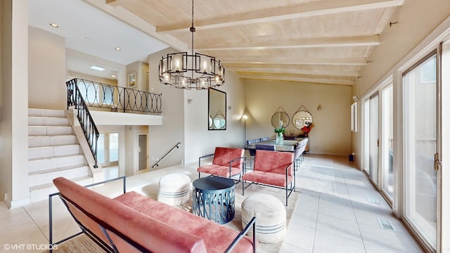 tiled living room featuring a chandelier and lofted ceiling with beams