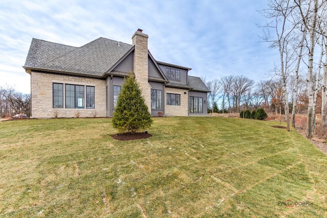 rear view of house with a lawn