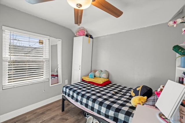 bedroom featuring ceiling fan and dark hardwood / wood-style floors