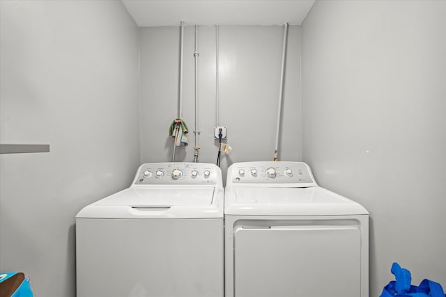 clothes washing area featuring washing machine and clothes dryer