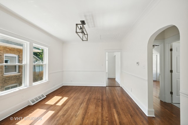 unfurnished dining area with dark hardwood / wood-style flooring and ornamental molding