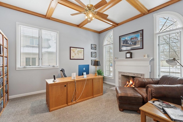 office space with beamed ceiling, light colored carpet, plenty of natural light, and coffered ceiling